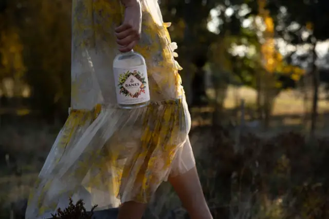 non-alcoholic spirit held by lady walking