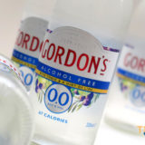 Gordons Gin and Tonic bottles in different positions in the foreground and background