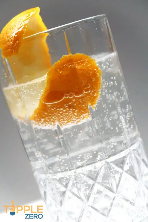 Non alcoholic Gin and Tonic in a glass with orange peel