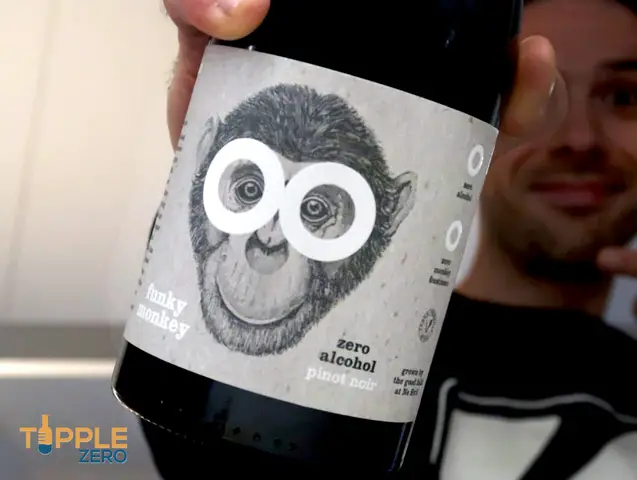 Funky Monkey Pinot Noir in hand with Jonathan behind it