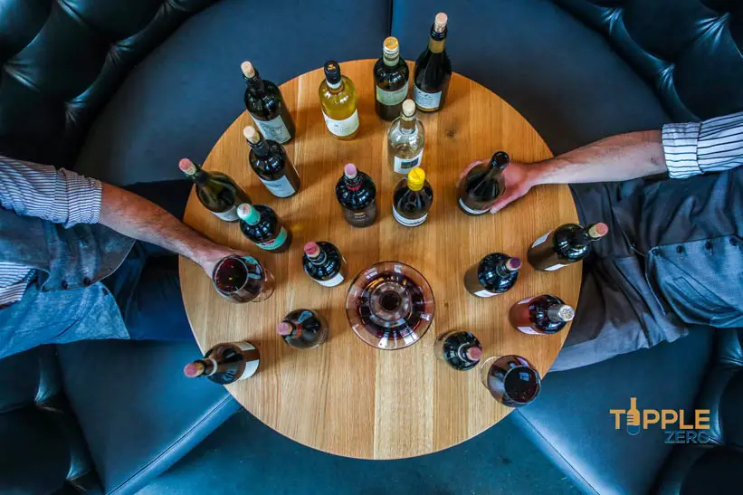 wine tasting with bottles of wine on a round table