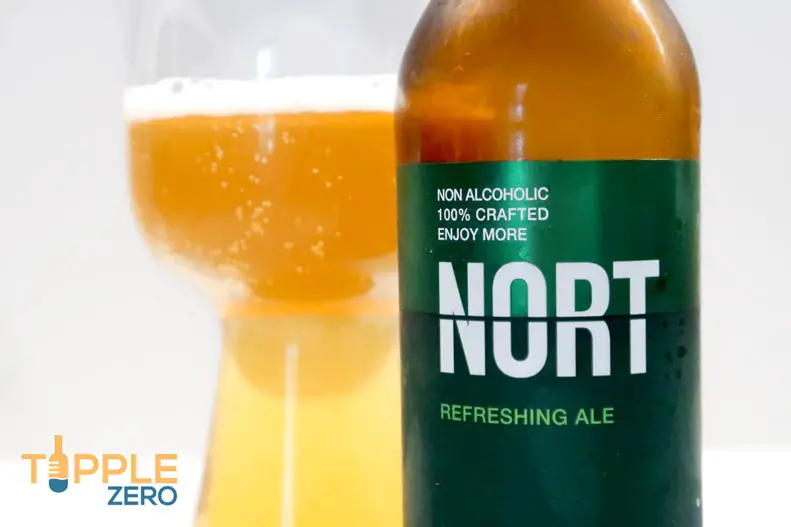 Close up of Nort Refreshing Ale bottle label and glass full of beer
