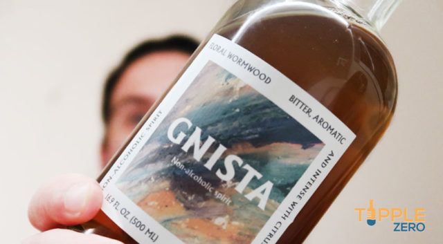 Gnista Floral Wormwood bottle in hand close up