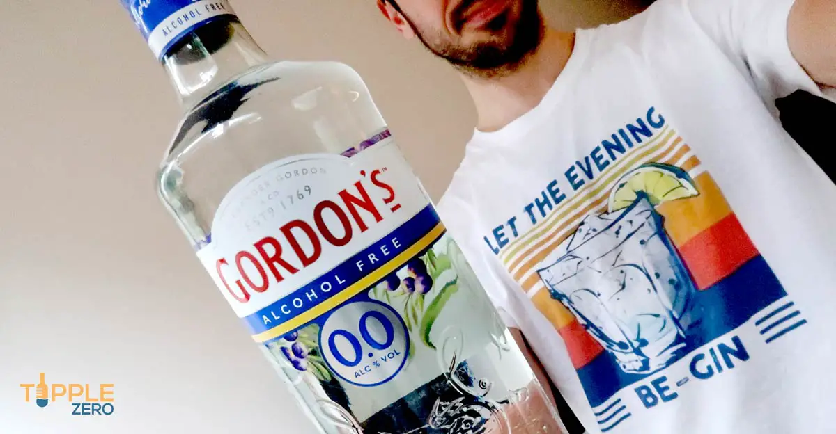 Gordon's Alcohol Free Gin Bottle held out in front of man
