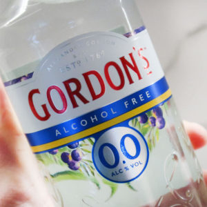 Gordon's Alcohol Free Gin Bottle in hand