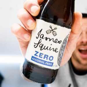 James Squire Zero Lager bottle being held out in front