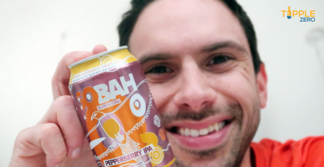 sobah pepperberry ipa can behind held close to camera with male behind it