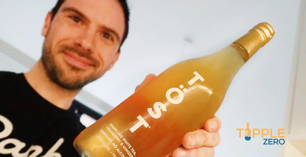 Tost Non-Alcoholic Sparkling being held by man
