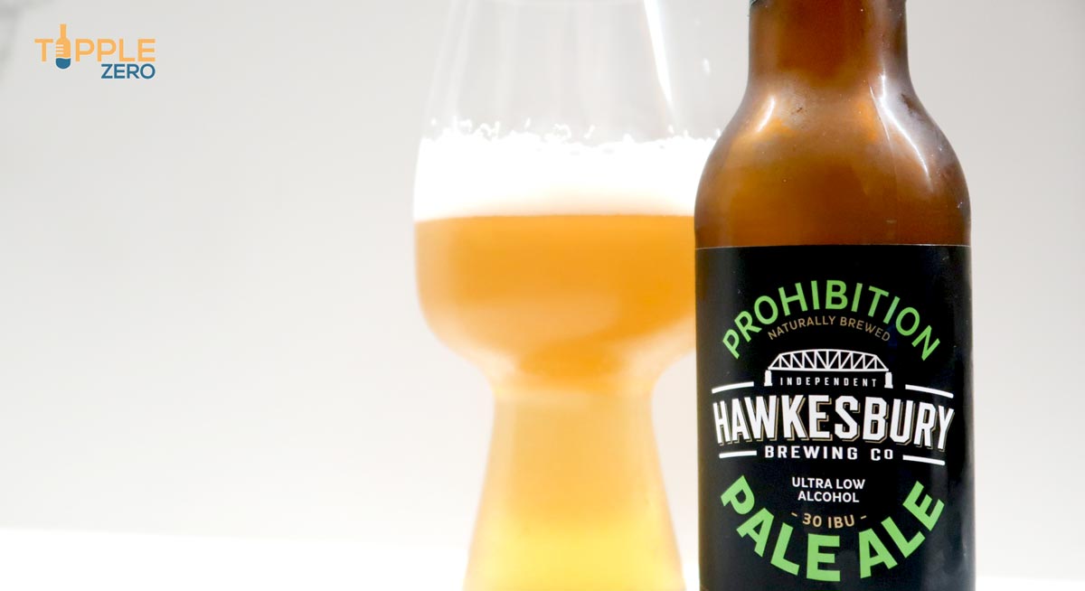 Hawkesbury Pale Ale in glass behind bottle