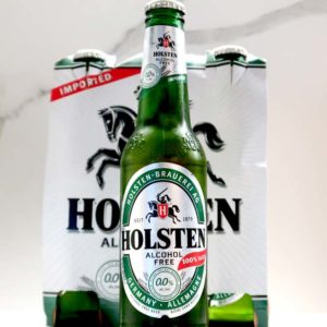 Holsten Beer Bottle On Bench in front of Retail Packaging