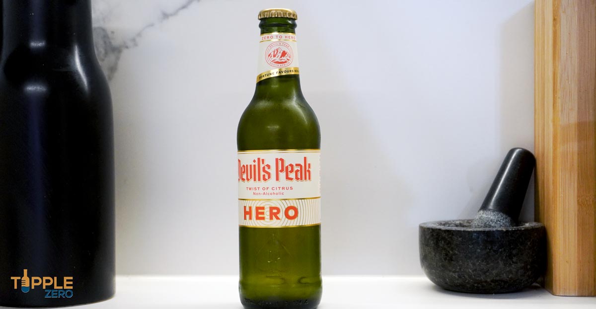 Devils Peak Hero Twist of Citrus hero image of bottle and label on bench