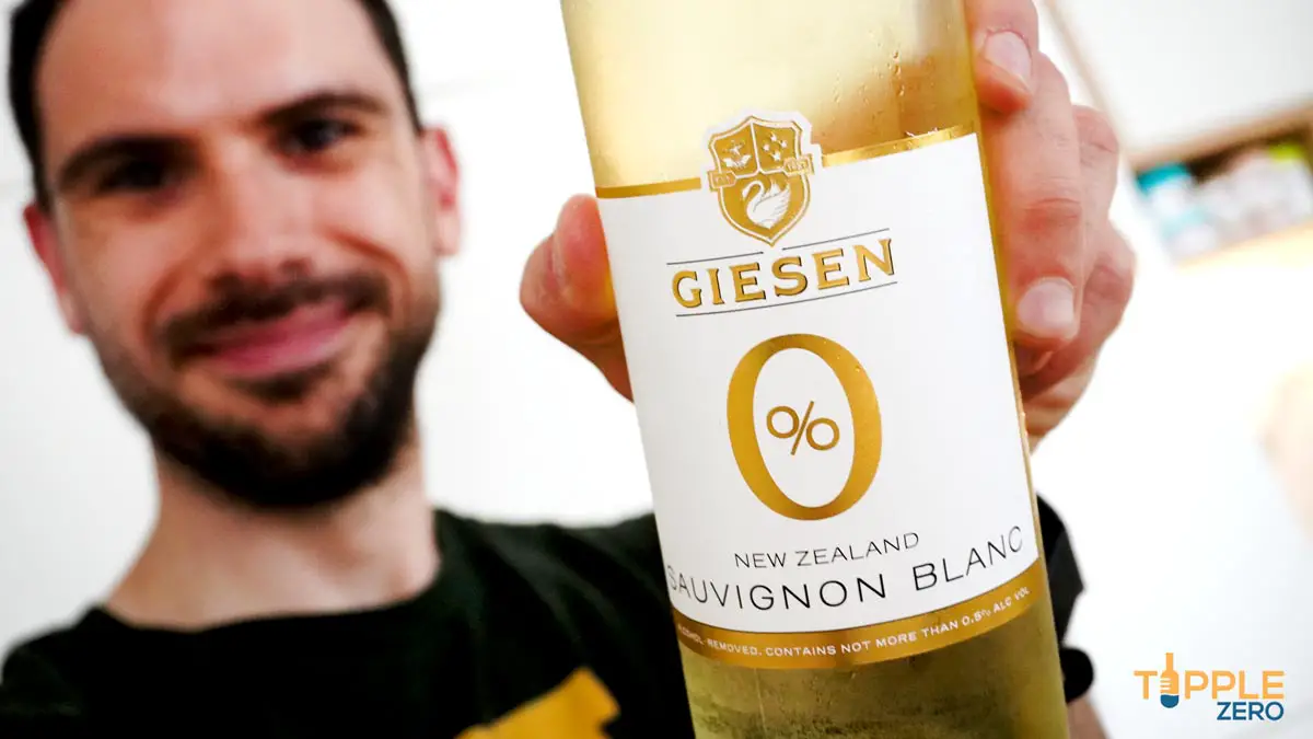 Giesen Zero Sauvignon Blanc held in hand