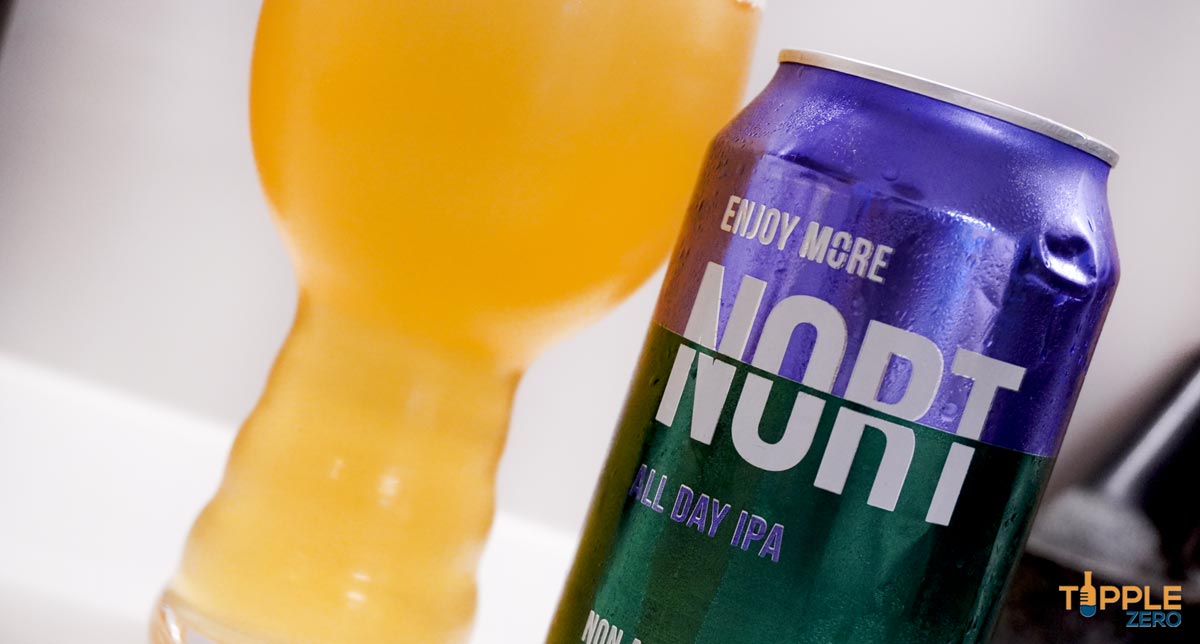 close up of non-alcoholic beer from Nort in glass and can