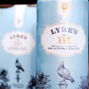 Non Alcoholic Lyres Gin + Tonic cans inside of retail packaging