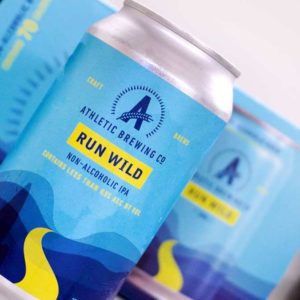 Athletic Brewing Co Run Wild IPA Can showing label in front of retail packaging